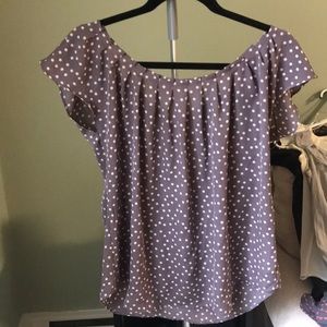 Small, gray with white polka dotted blouse.